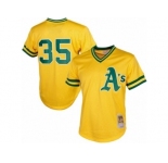 Men's Mitchell and Ness Oakland Athletics #35 Rickey Henderson Replica Gold 1984 Throwback MLB Jersey