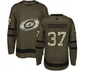 Men's Carolina Hurricanes #37 Andrei Svechnikov Green Salute to Service Stitched Hockey Jersey